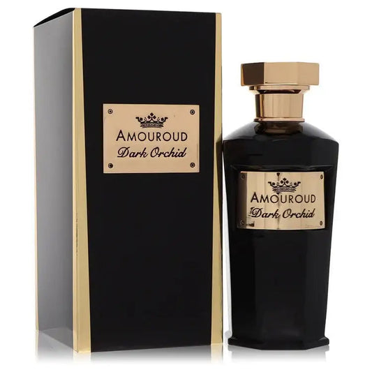 Unisex eau de parfum bottle with dark glass and gold cap beside black gift box