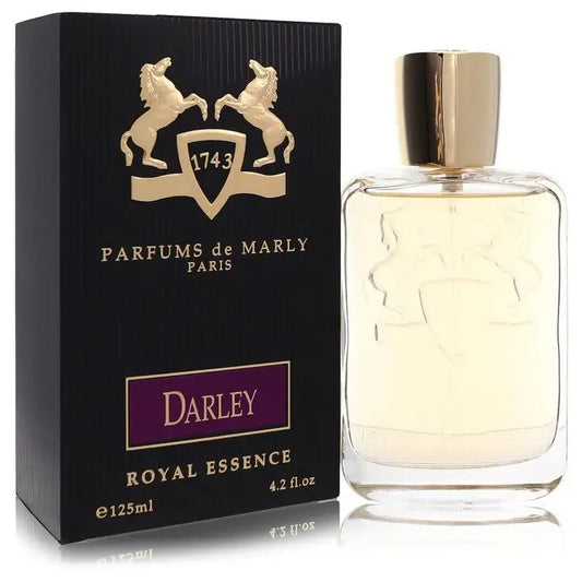 Women's clear perfume bottle with gold cap and Darley box, front view