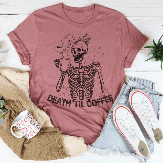 Mauve T-shirt with white skeleton holding a coffee mug graphic and “DEATH TIL COFFEE” text