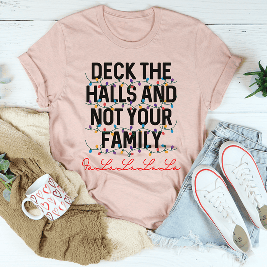 Blush pink T-shirt with colorful 'Deck the Halls and Not Your Family' graphic