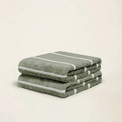 Sage green cotton towels set, folded stack with white stripe trim