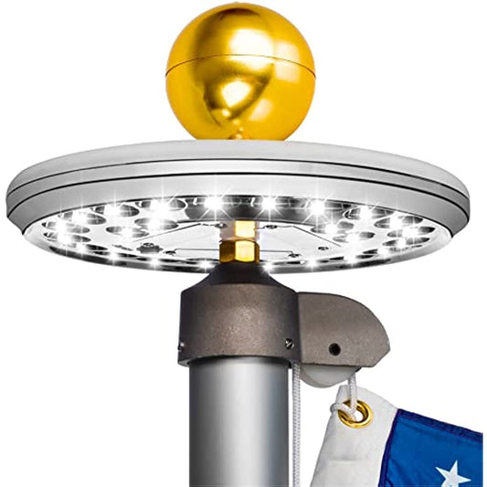 Solar flagpole light with gold globe top and round LED head for pole mounting