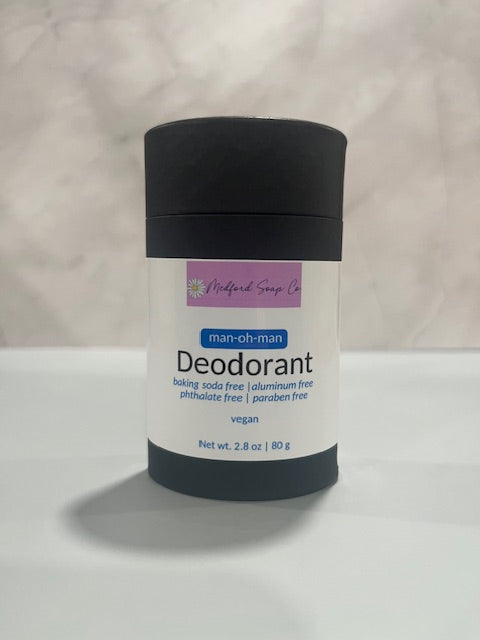 Deodorant stick with black cap, white label, man-oh-man scent