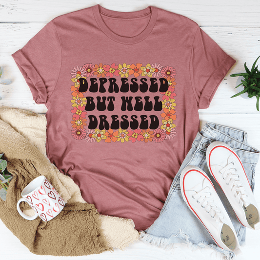 Mauve graphic T-shirt with floral "Depressed But Well Dressed" lettering