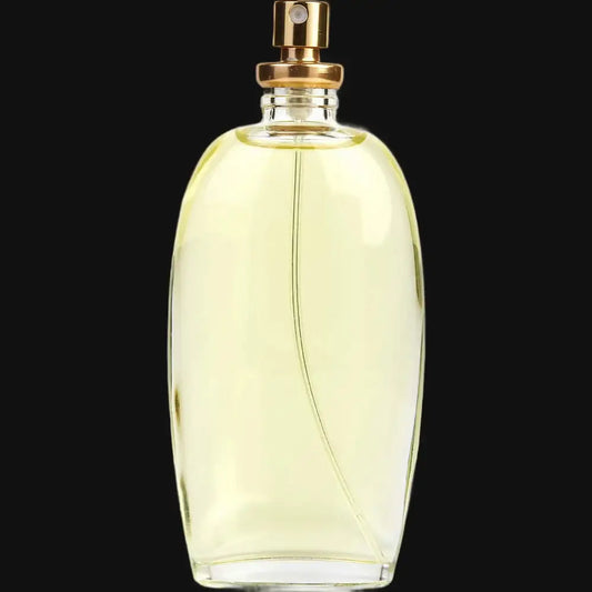 Women's perfume bottle, pale yellow glass with gold sprayer and cap