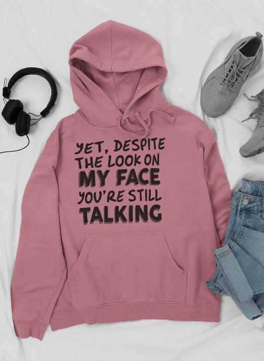 Mauve pullover hoodie with hood, drawstring, front pocket and bold text graphic.