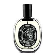 Eau de parfum spray bottle, black cap, rounded clear glass with oval label