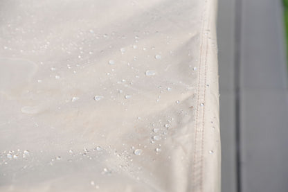 Outdoor furniture cover fabric with water droplets, tan waterproof coating