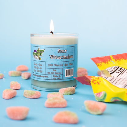 Hockey candle in clear jar with light blue wax, “Sour Watermelon” label