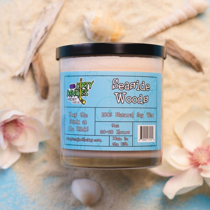 Hockey candle in clear jar with light brown wax, “Seaside Woods” label
