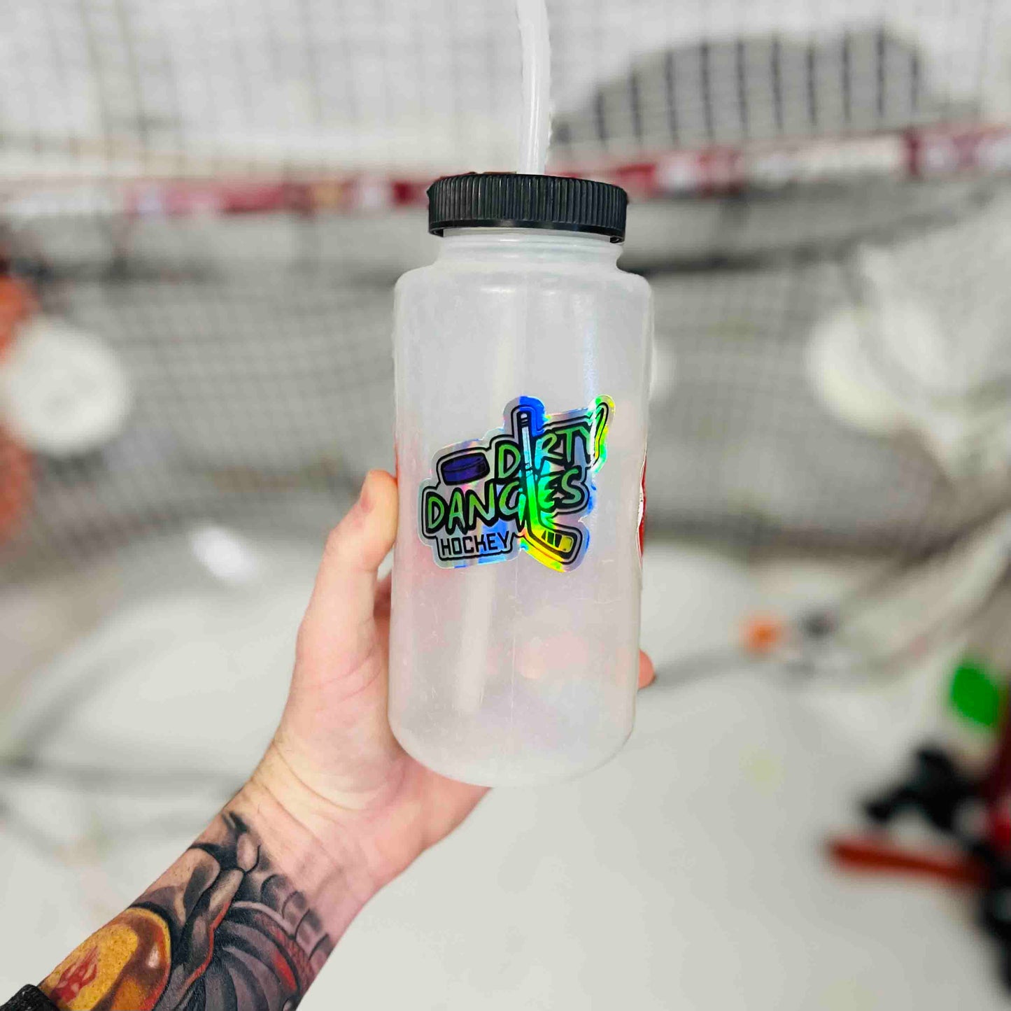 Translucent bottle with colorful hockey logo sticker on front