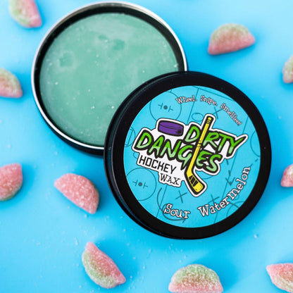 Round hockey wax tin with light green wax and black lid with Dirty Dangles logo