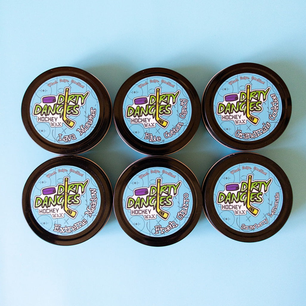 Set of round hockey wax tins with Blue Cotton Candy, Lava Monster, and other color wax lids