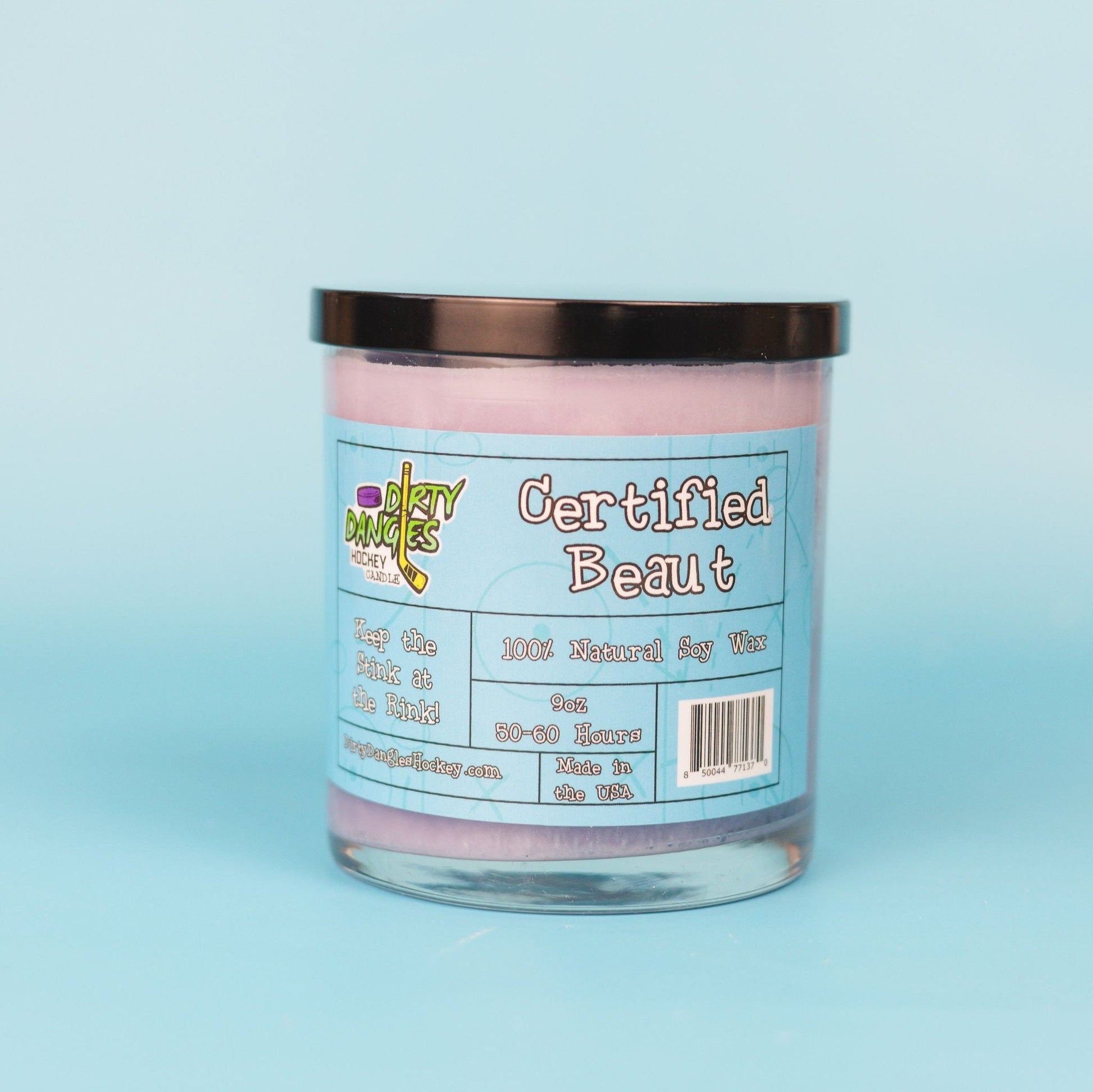 Lavender-pink candle jar with black lid and front label, 100% soy wax text