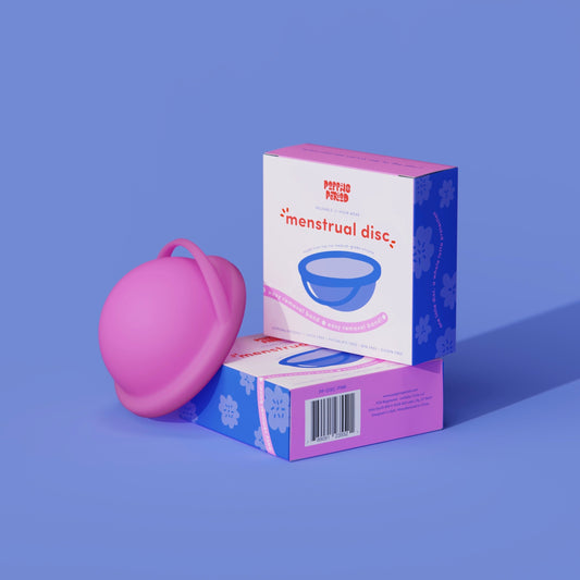 Menstrual disc starter kit with pink disc and box packaging
