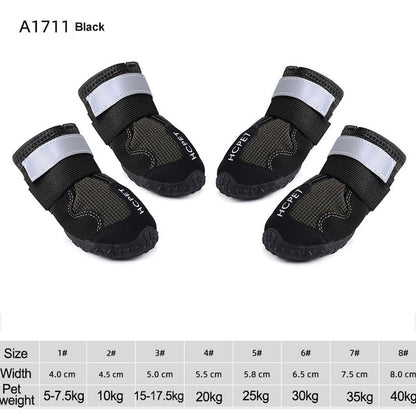Black waterproof dog boots with silver reflective straps and textured rubber soles