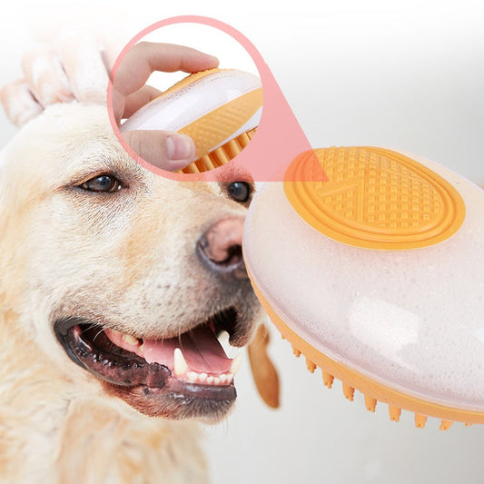 Pet bath massage brush with orange silicone bristles being used on a dog