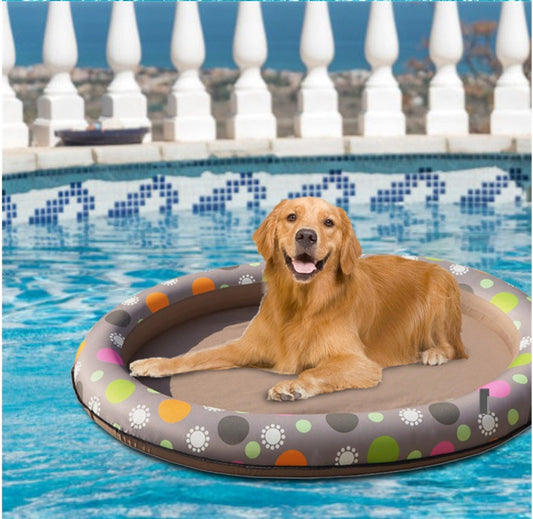 Inflatable pet pool hammock float with multicolor paw-dot pattern and cushioned ring