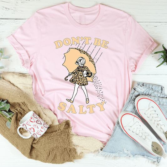 Pink graphic T-shirt with crew neck and 'DON'T BE SALTY' umbrella girl print
