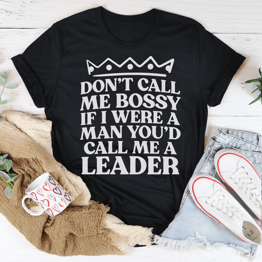 Black crewneck T-shirt with crown graphic and bold quote text 'Don't call me bossy'.