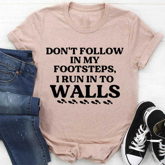 Light mauve crew-neck T-shirt with bold “Don’t follow…” slogan graphic