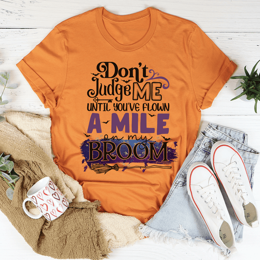Burnt orange T-shirt with "Don't Judge Me" broom graphic text