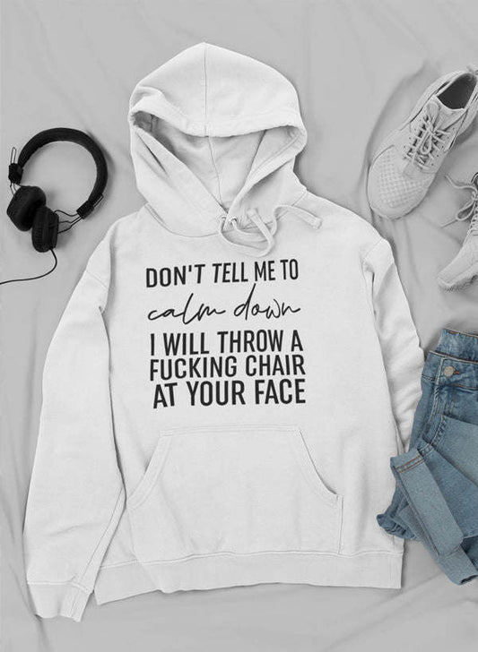 White pullover hoodie with front pocket and drawstring, printed slogan on chest