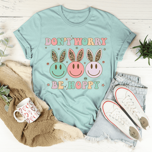 Teal T-shirt with 'DON'T WORRY' and 'BE HOPPY' smiley graphic