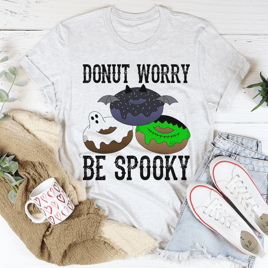 Gray crewneck T-shirt with bat-and-donut graphic and bold text 'Be Spooky'