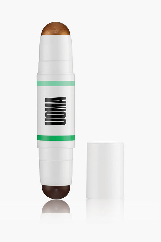 Contour stick in white tube with green stripe and brown cap tip; shown with open stick