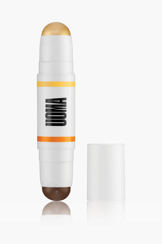 Contour stick in white tube with orange stripe and brown cap tip; shown with open stick