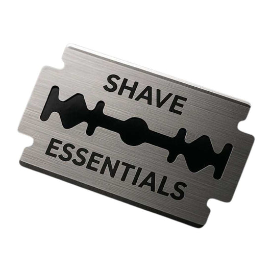 Safety razor blades on metal card, SHAVE ESSENTIALS text