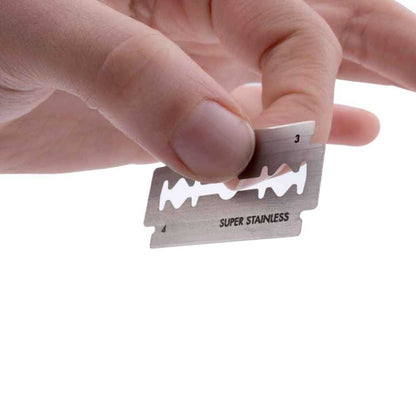 Double-sided safety razor blade on holder, labeled SUPER STAINLESS