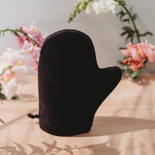 Double-sided velvet tanning mitt in dark black, mitten-style glove with thumb