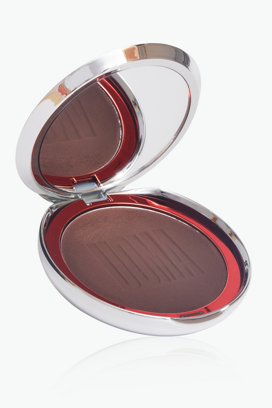 Bronzing and sculpting powder compact, open to show medium brown powder pans