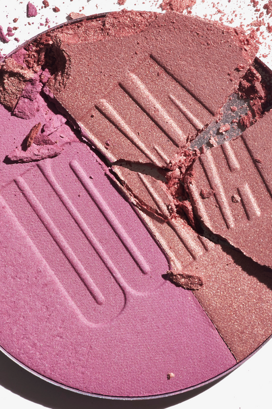 Rose and mauve blush powder compact pan with embossed streaks and cracked texture