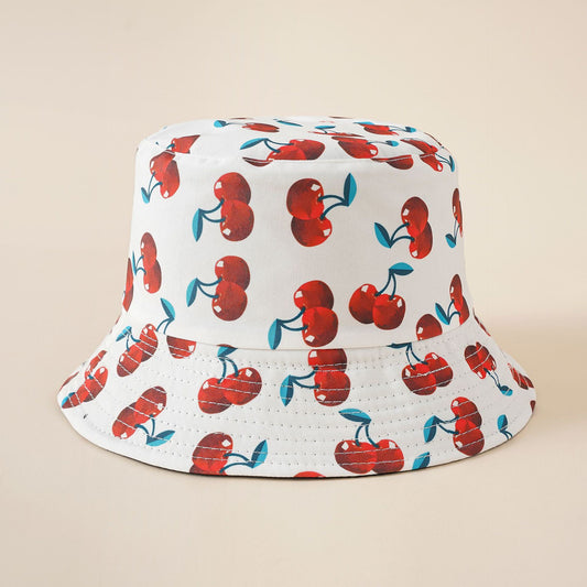 White cherry print bucket hat with wide brim and breathable eyelet stitching
