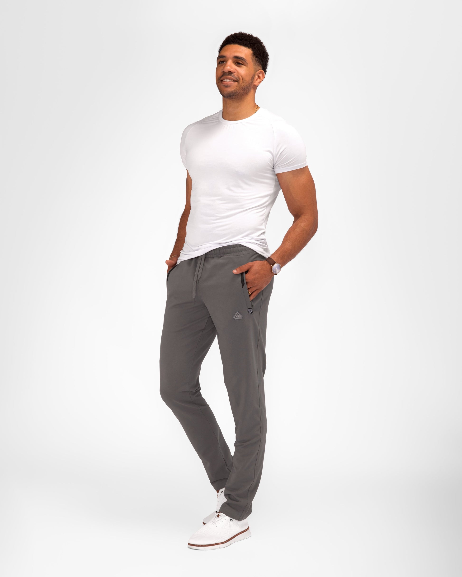 Dark gray tapered athletic sweatpants with elastic waistband and side pockets