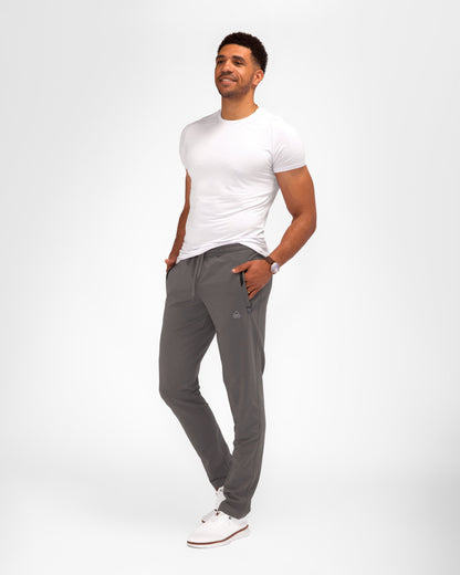 Dark gray tapered athletic sweatpants with elastic waistband and side pockets