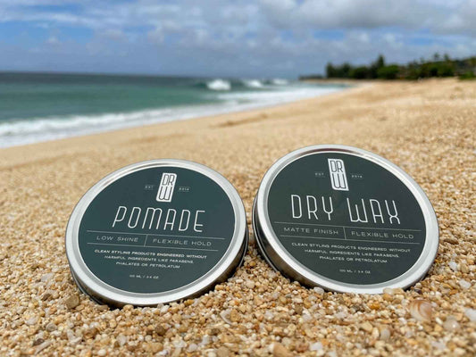 Pomade and hair cream tins with dark green labels and Dr. Watson's branding
