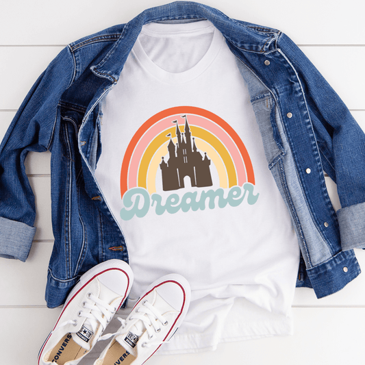 White T-shirt with rainbow castle graphic and 'Dreamer' text