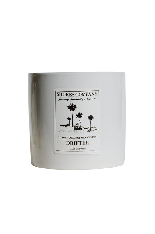 Coconut wax candle jar with Shores Company Drifter label