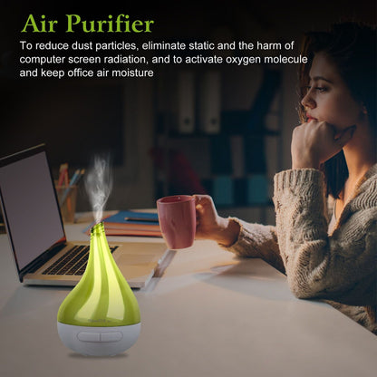 Green drop-shaped humidifier aroma diffuser releasing mist, white base with front button
