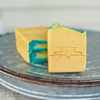 Bar soap with yellow and teal swirls, FARMHOUSE logo
