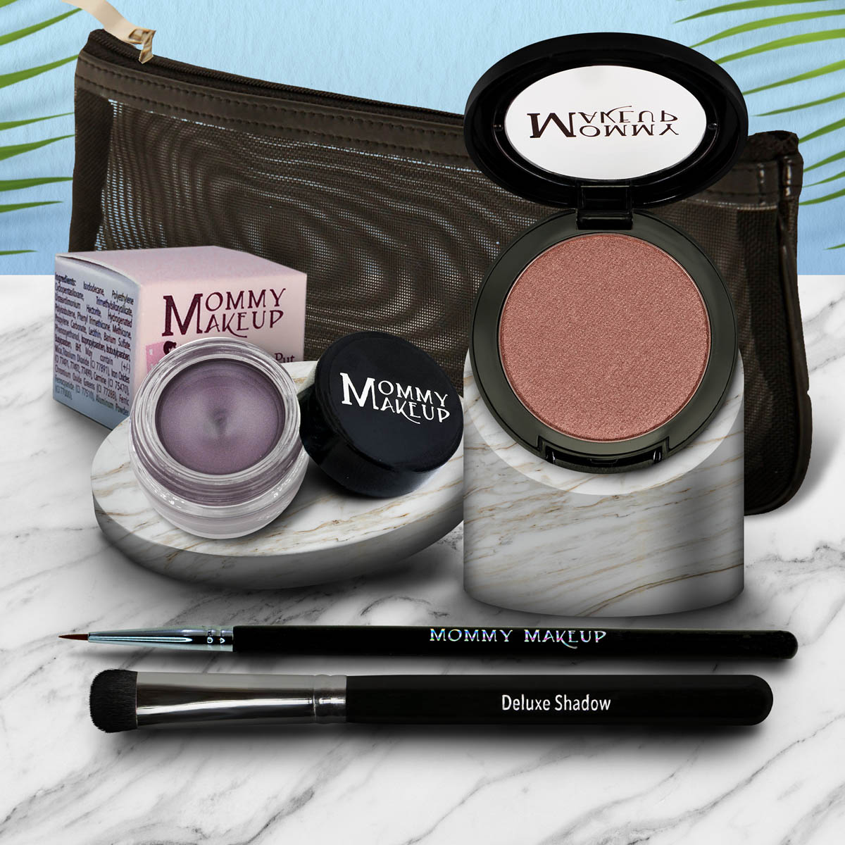 Eyelook set with pink eyeshadow pan and purple gel pot, plus brush and eyeliner pen.
