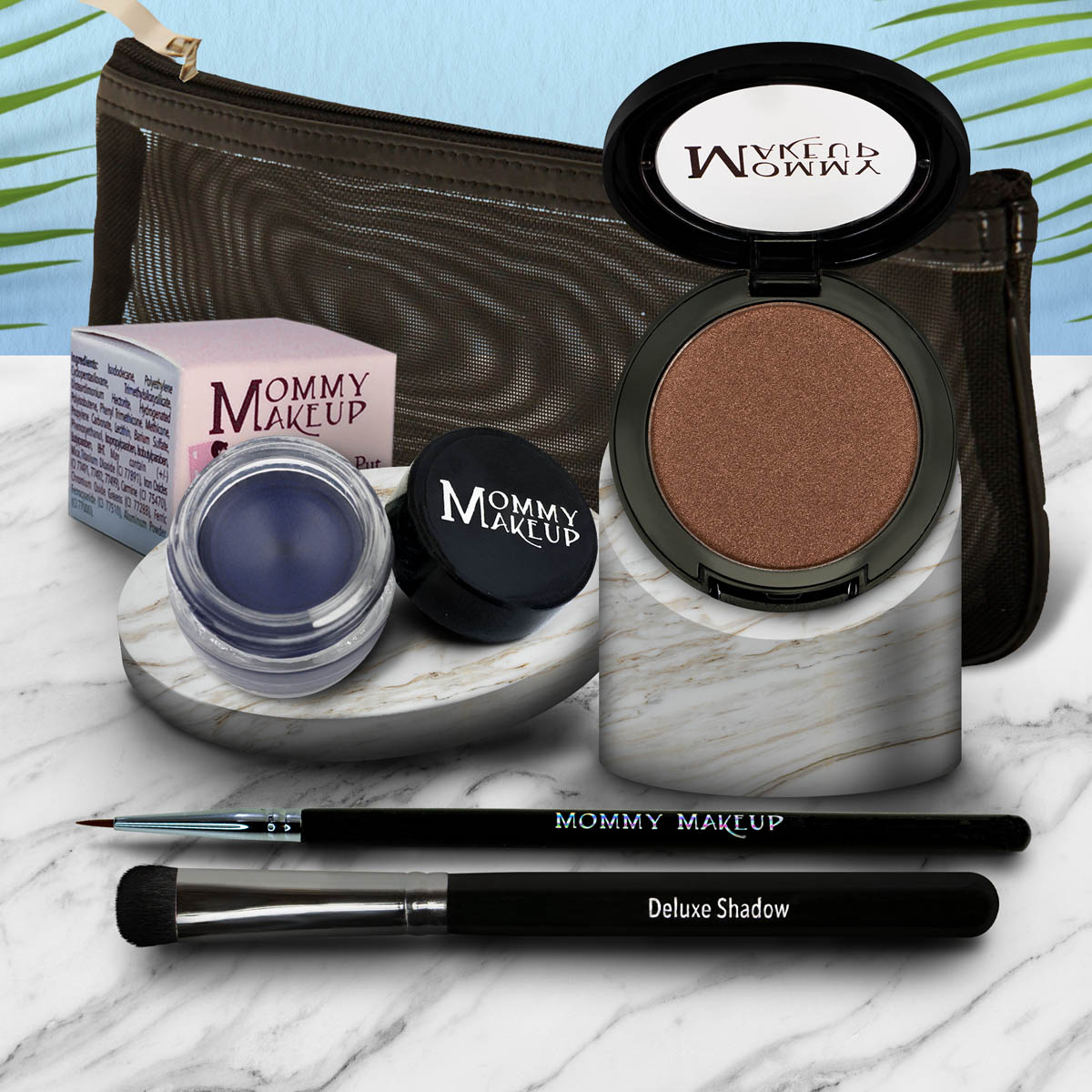 Eye makeup set with bronze shimmer eyeshadow pan, dark brush, and blue-toned gel pot