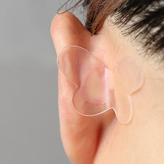 Silicone ear corrector sticker applied to outer ear for contour support