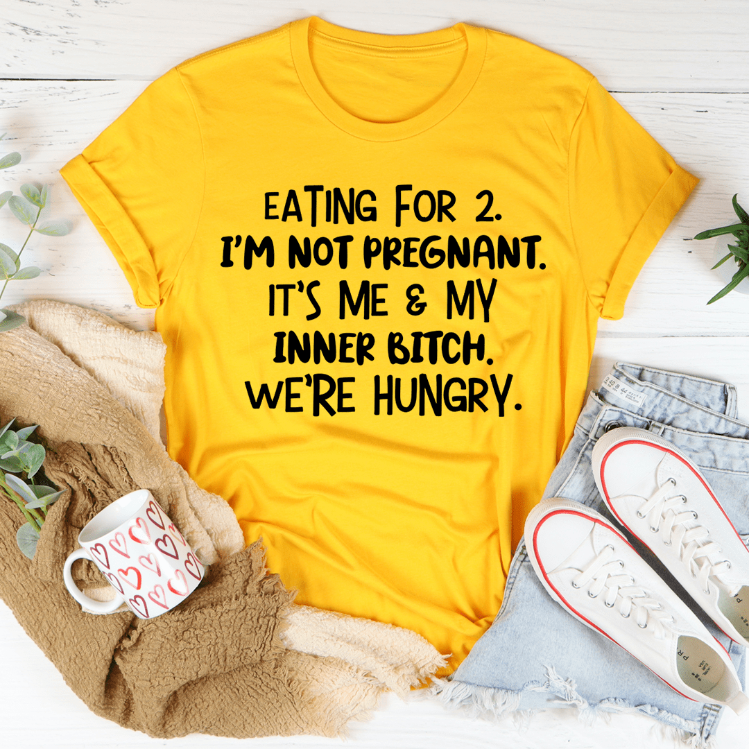 Mustard crewneck T-shirt with “EATING FOR 2” graphic text