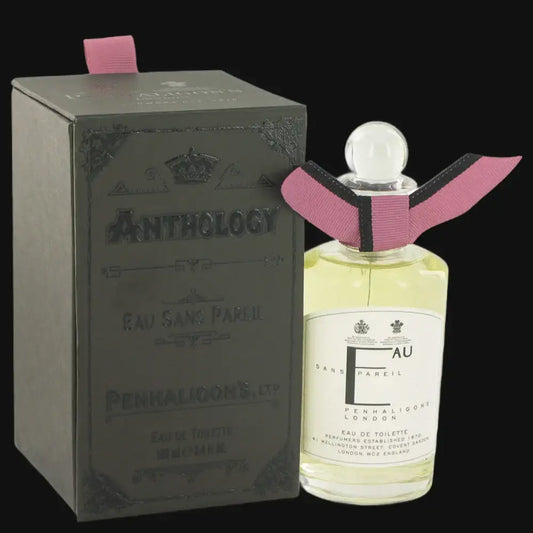Women’s perfume bottle with pink ribbon and glass cap, beside Eau Sans Pareil box