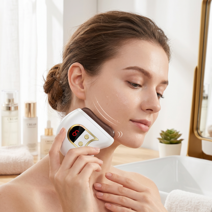 Electric gua sha facial sculpting device held to face, white body and red display